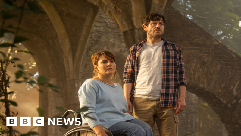Ruth Madeley and Iwan Rheon in the new TV drama series. They both look concerned and are inside the ruins of an old building