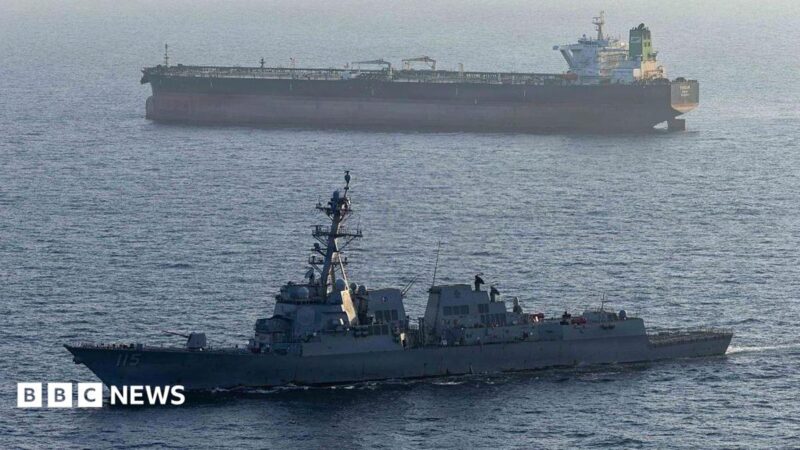 A US military ship is seen in the foreground in the Arabian Sea in April, while another ship is seen in the background