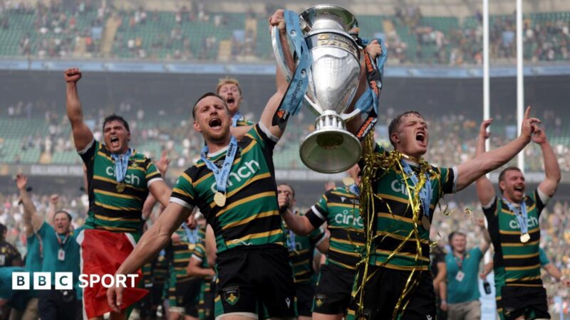 Fraser Dingwall (left) holds the Prem trophy aloft in his left arm and Fin Smith (right) holds it in his left, with his
