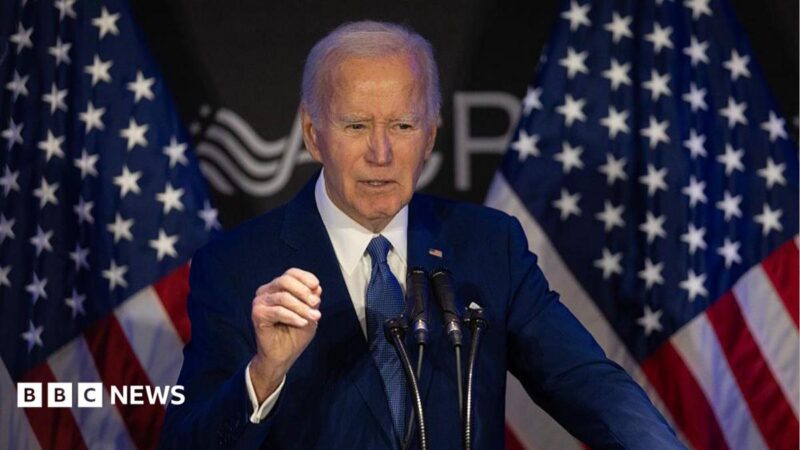 Biden speaking with American flags behind him in Chicago in April