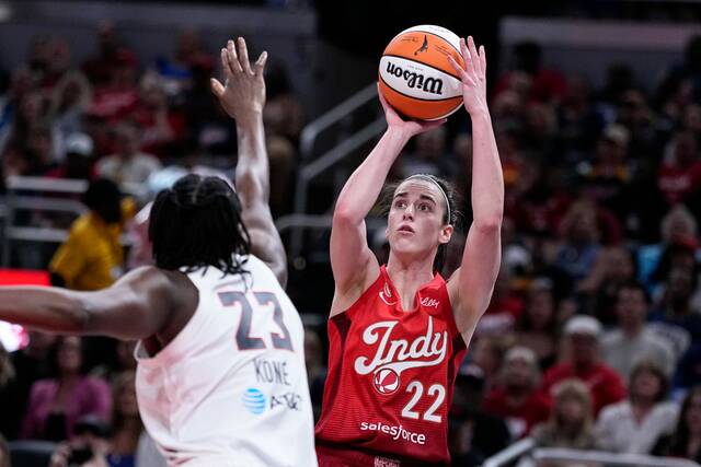 Indiana Fever guard Caitlin Clark shoots over Atlanta Dream forward Sika Kone last month. (AP)