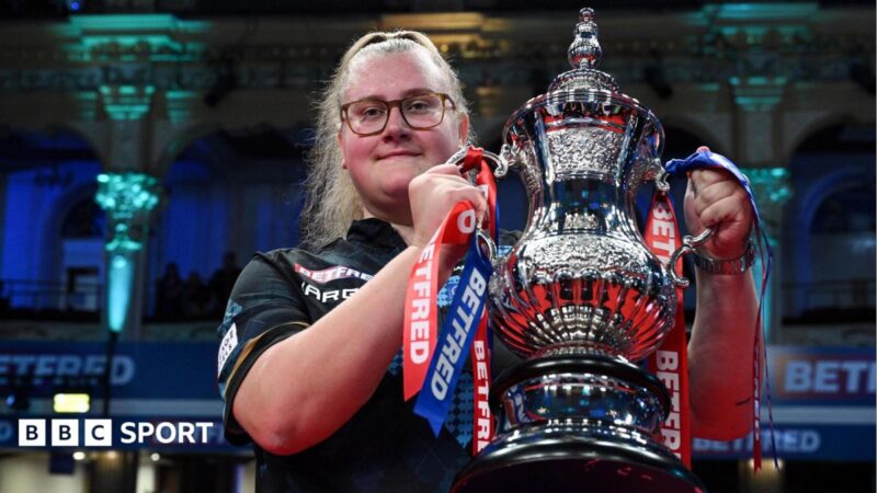 Beau Greaves celebrates winning the Women's Matchplay at Winter Gardens in Blackpool by lifting the silver trophy aloft