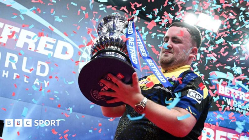Luke Littler celebrates beating Gerwyn Price in the World Matchplay final at Winter Gardens in Blackpool by lifting the