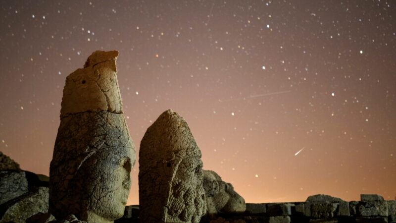 Ancient statues are seen during the Perseid meteor shower atop Mount Nemrut in southeastern Turkey, Sunday, Aug.11, 2024