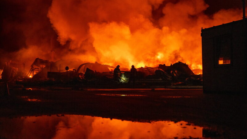 Firefighters put out a fire after Russian missiles hit a warehouse in Kyiv, Ukraine, Wednesday, Aug. 5, 2026. (AP Photo/Dan