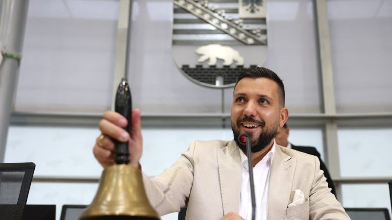 Newly elected state parliament speaker Tobias Rausch of the AfD rings the bell after a break during the first session of the