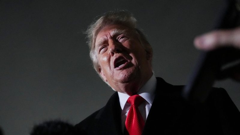 US President Donald Trump speaks to members of the media after disembarking Air Force One, after attending a campaign rally