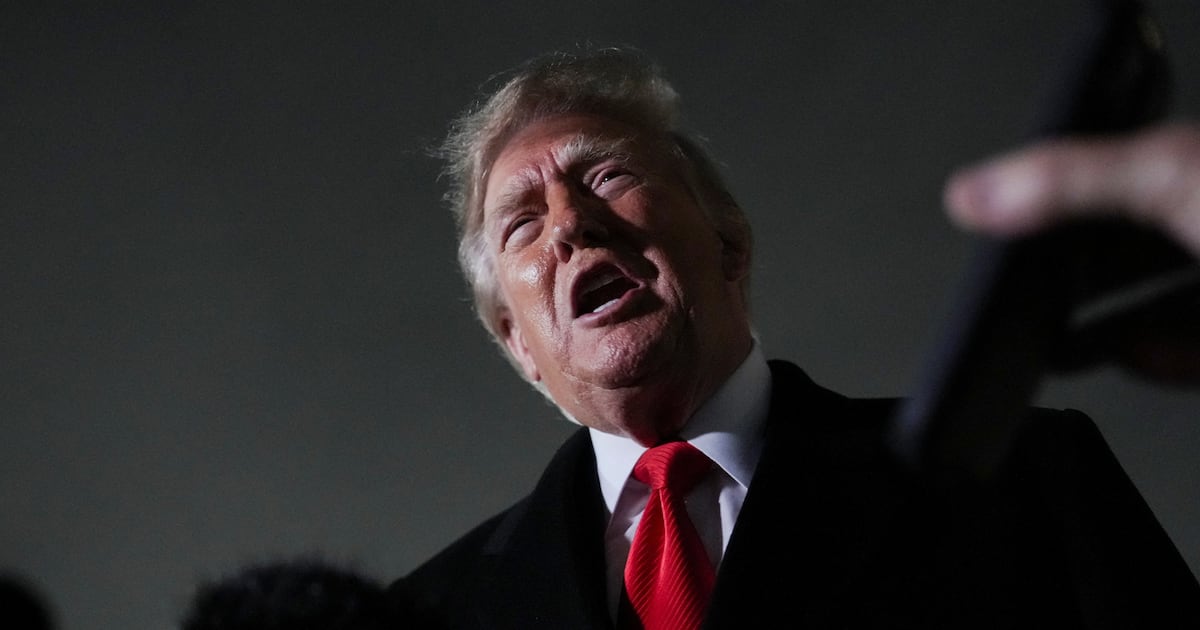 US President Donald Trump speaks to members of the media after disembarking Air Force One, after attending a campaign rally