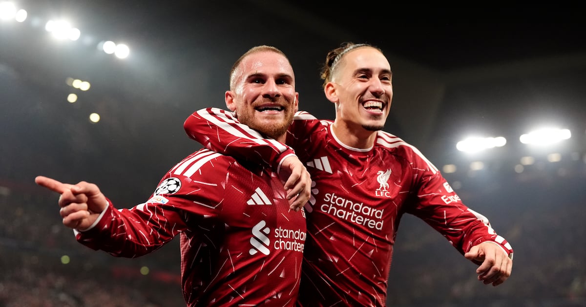 Alexis Mac Allister celebrates scoring Liverpool's third goal with team-mate Kostas Tsimikas (right). Photograph: Nick