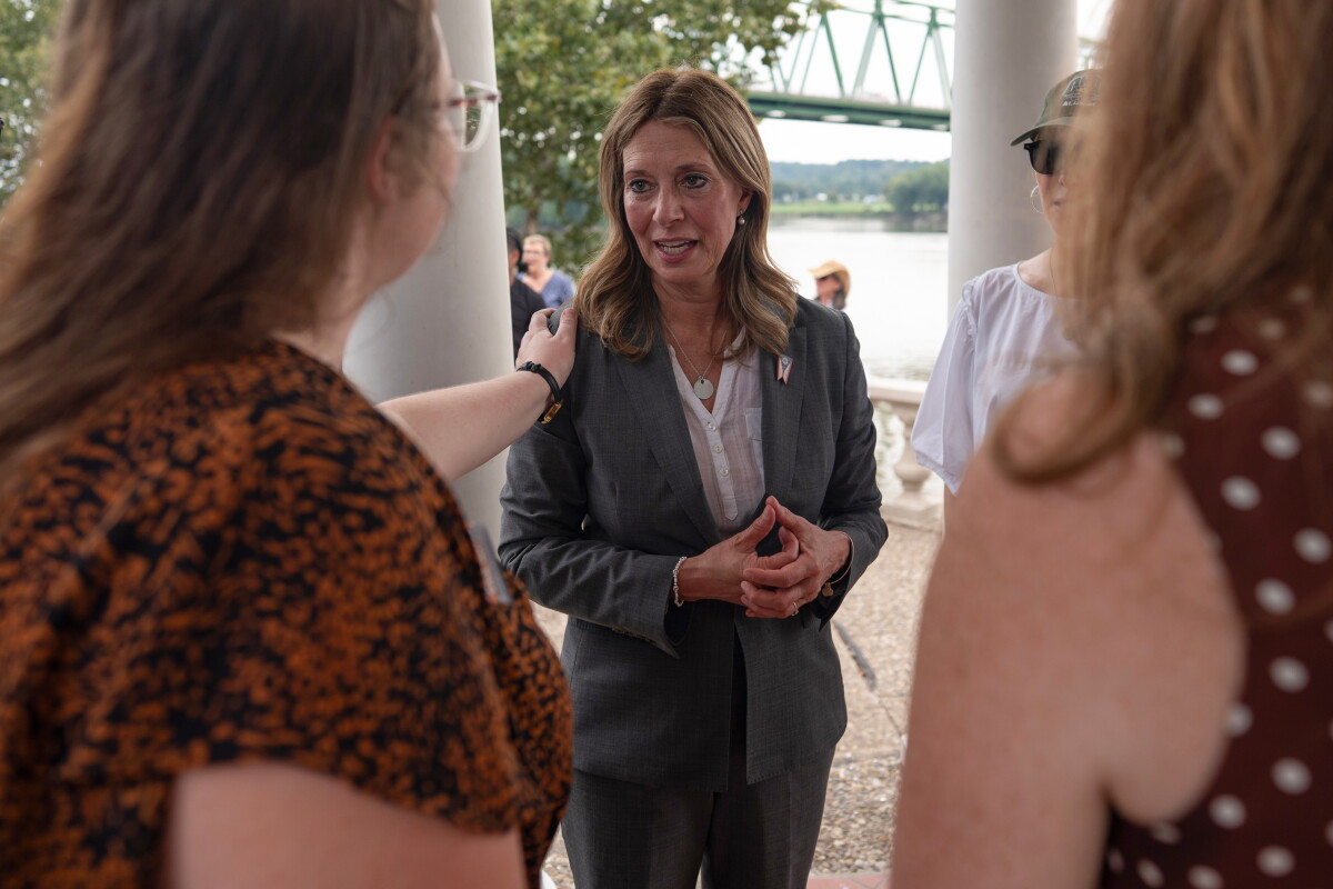Democratic gubernatorial candidate Dr. Amy Acton speaks with supporters during a campaign event along the Ohio River, in