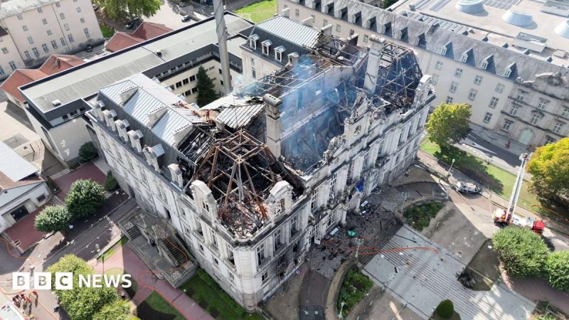 A drone shot shows the burnt roof of the city hall in Limoges. The structure of the top of the building has been revealed by