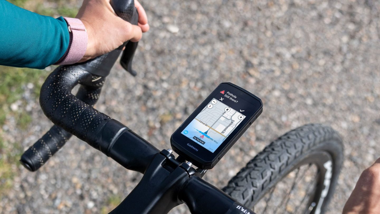 A Garmin Edge 1060 cycling computer mounted to a handlebar